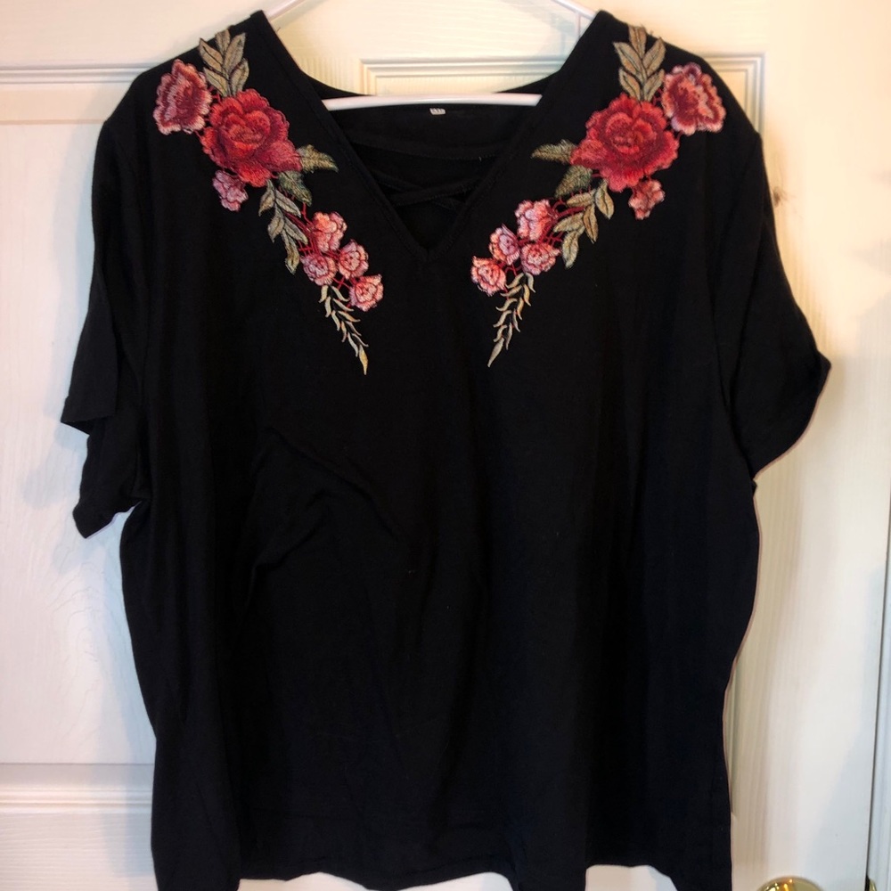 Black top with floral designs